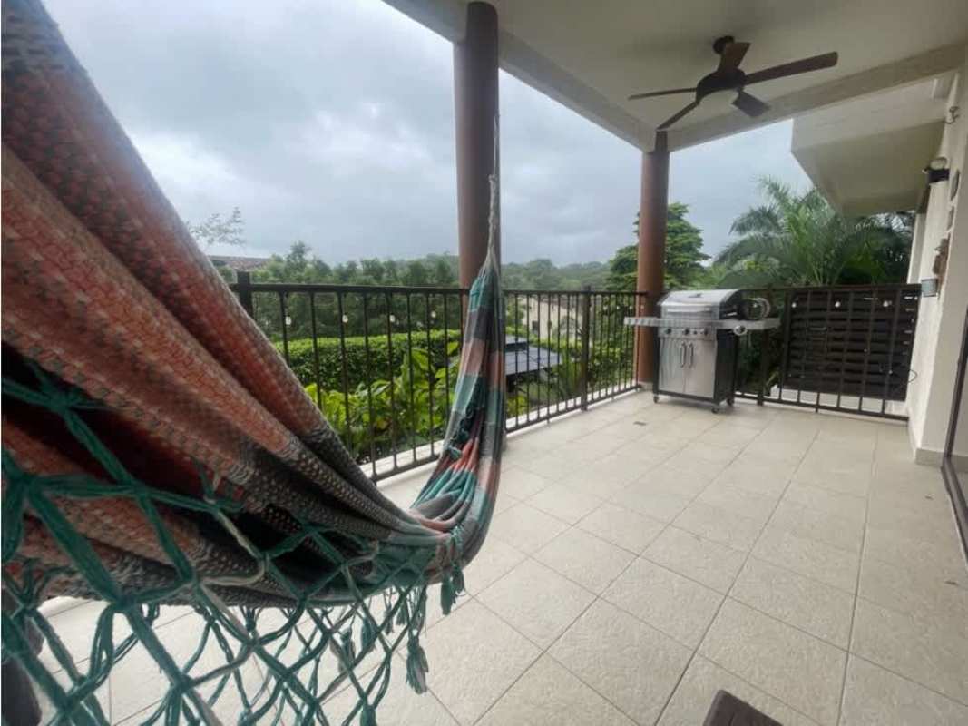 Bright bedroom with nature views and ceiling fan in Embassy Club Clayton Panama apartment