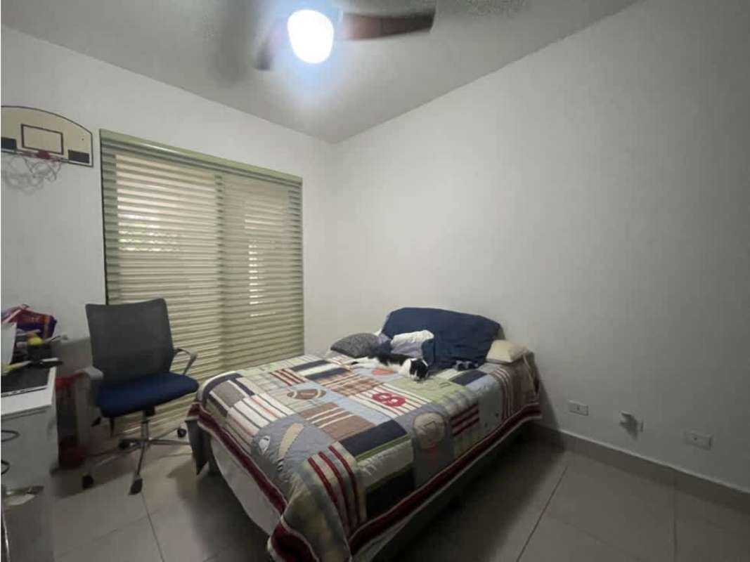 Modern living room with glass doors to private balcony in Embassy Club Clayton Panama