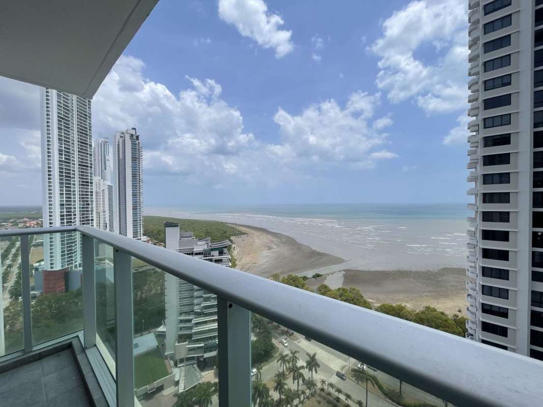 Living room with balcony access ocean and city skyline view PH Lumiere Costa del Este Panama
