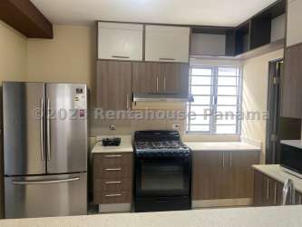 Children's playground with slides, benches, greenery at PH Palmia Woodlands Panama