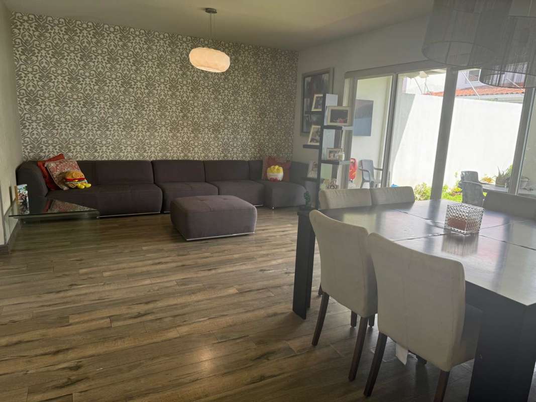 Living room with home theater setup and LED lighting in Panama Costa Sur house