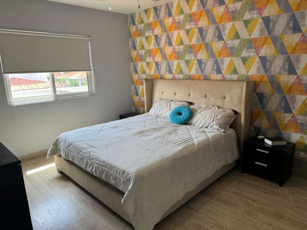 Bedroom with sports bedding, wall TV in Quintas de Versalles Costa Sur