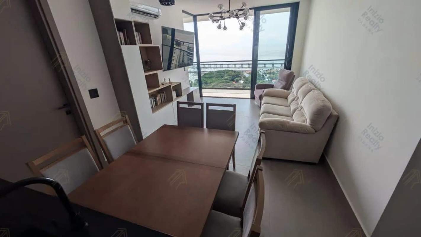 Glass balcony overlooking ocean and Panama skyline at Victory Wellness Coco del Mar