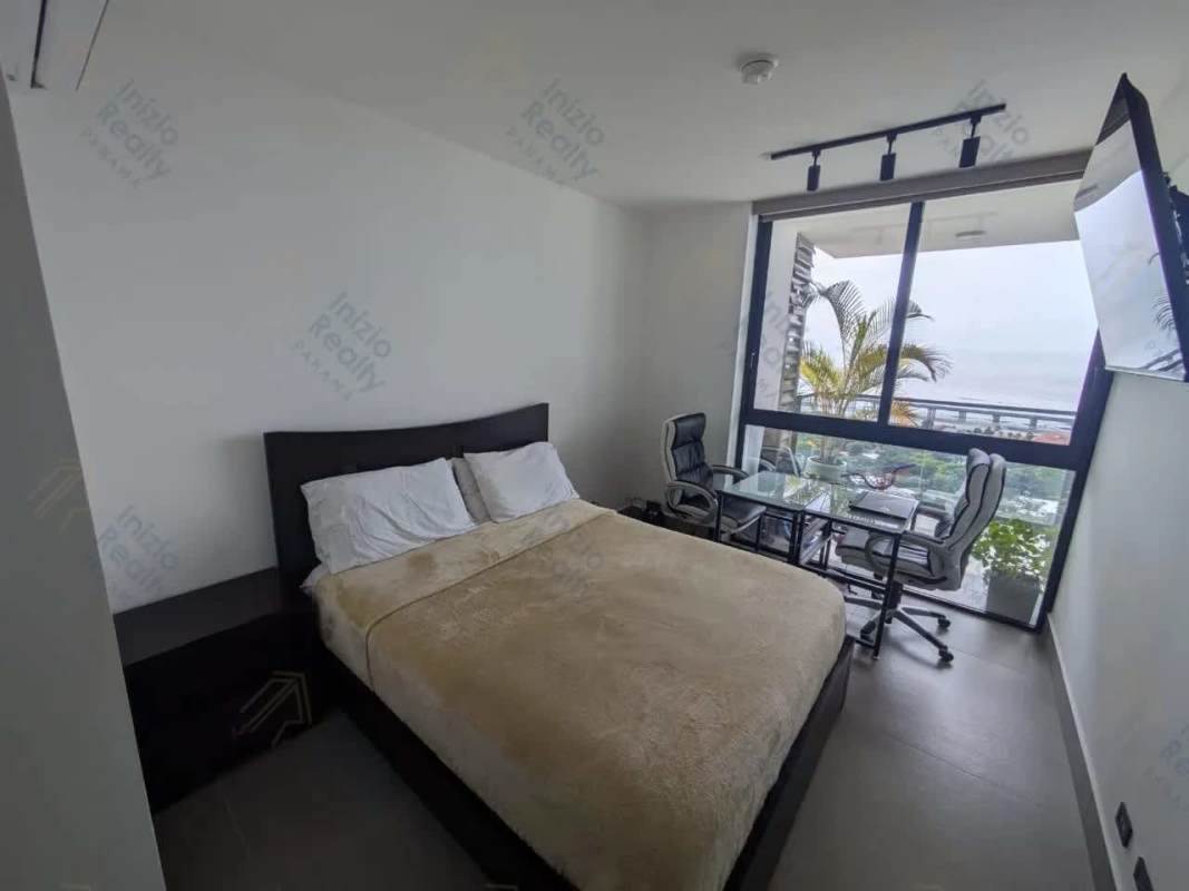 Master bedroom featuring large windows with ocean views in PH Victory Wellness Coco del Mar Panama
