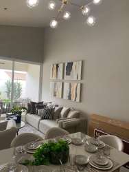 Spacious living and dining with glass doors to terrace at Bosques del Pacífico Panama Pacífico
