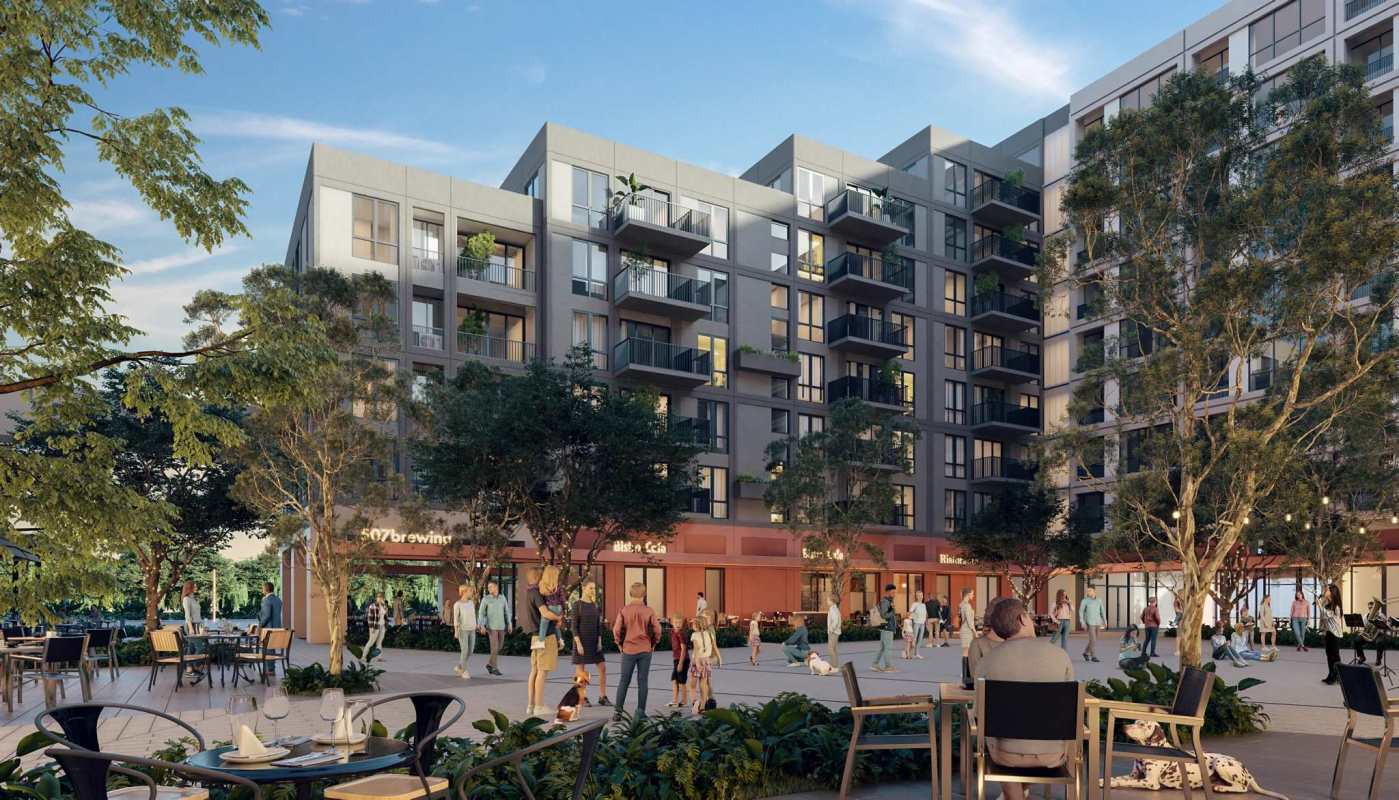 Co-working lounge area with floor-to-ceiling glass, communal tables and contemporary decor in Centriqo Panama