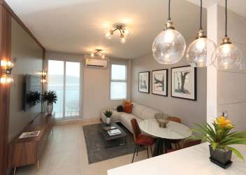 Open plan living dining with brown sofa, wooden dining table Panama Pacifico