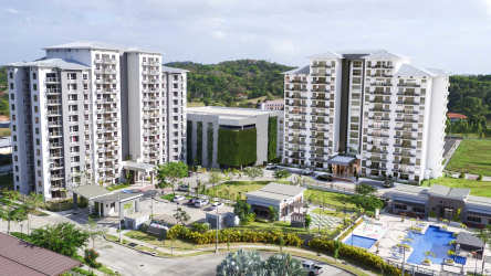 Aerial view of Parterre apartment complex with towers, pool, and gardens Panama Pacifico