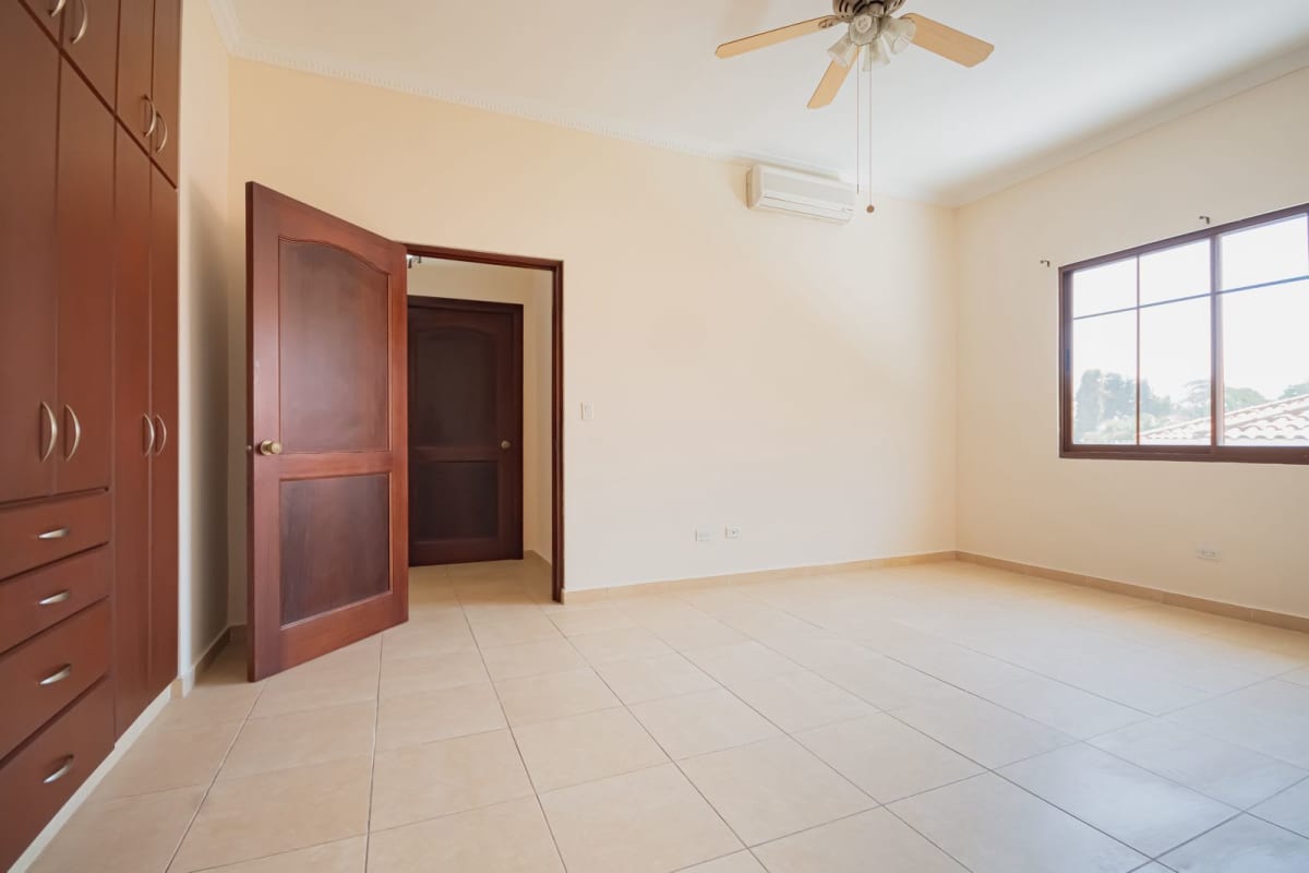 Large bedroom with tile floors, built-in closets, ceiling fan Clayton Panama