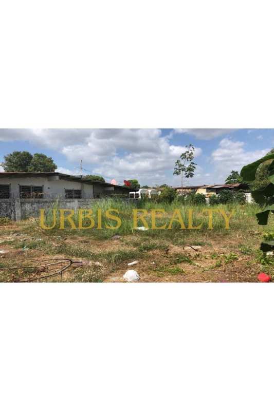 Open grassy vacant lot with fence ideal for residential or commercial development in Juan Díaz Panama