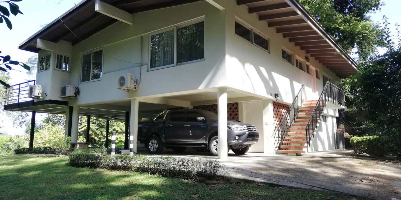 Master bedroom with balcony access forest view tiled floor Cerro Ancón Panama
