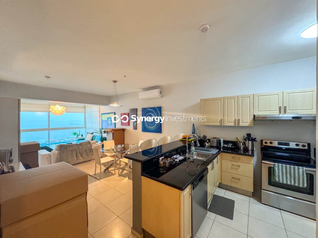 Modern bathroom with walk-in glass shower vanity and mirror at PH Miramar Towers Panama City