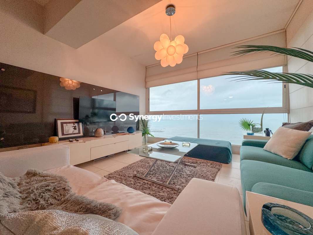 Furnished bedroom with panoramic bay view windows at PH Miramar Towers on Avenida Balboa Panama City