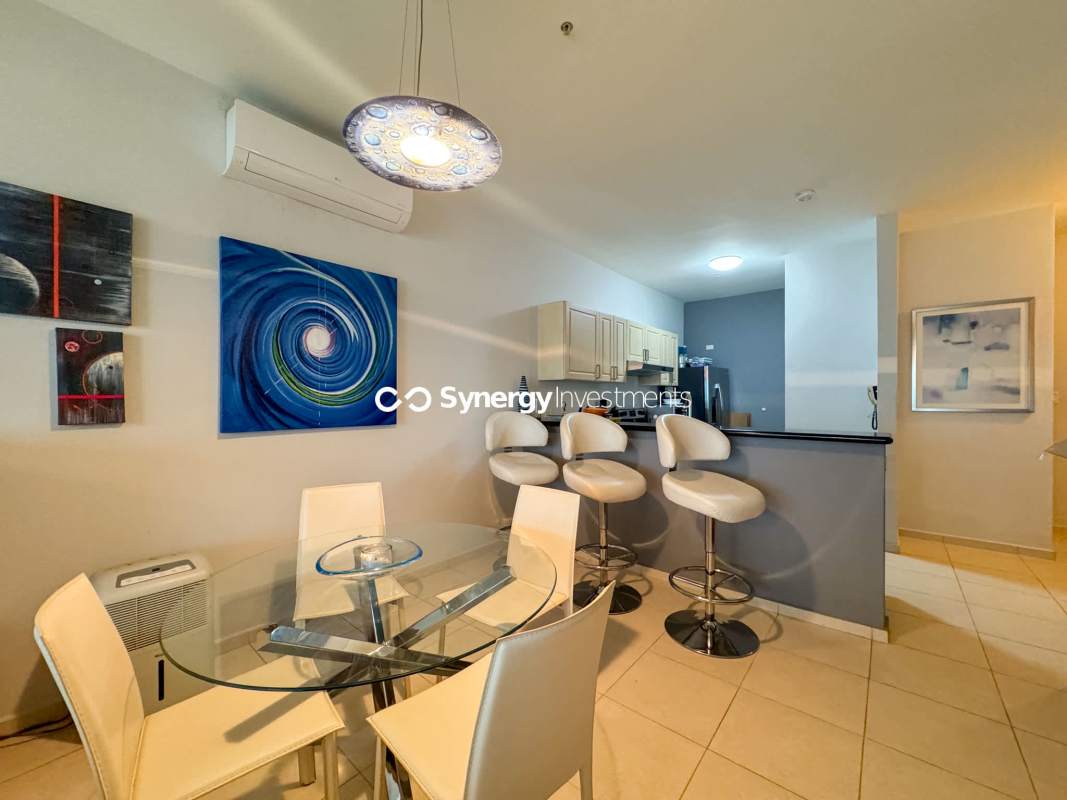 Contemporary kitchen with granite counters and stainless appliances in PH Miramar Towers Panama City