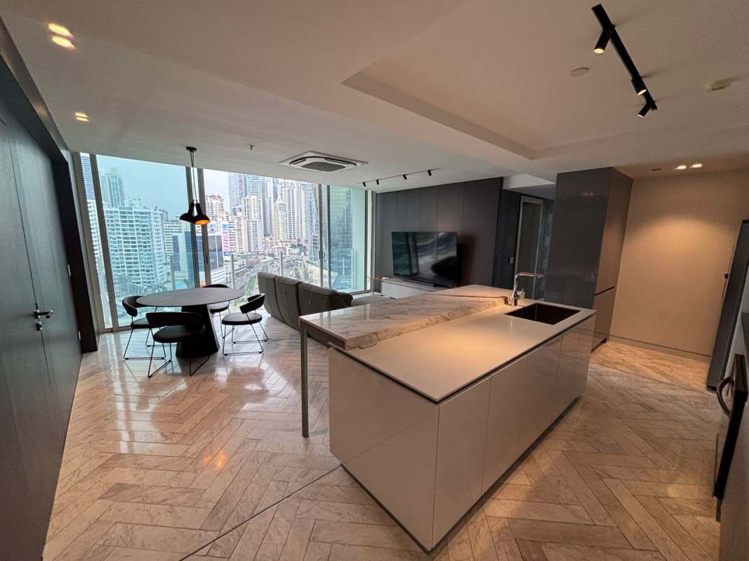 Dining area with floor-to-ceiling windows and ocean views at PH YOO Panama condo for sale