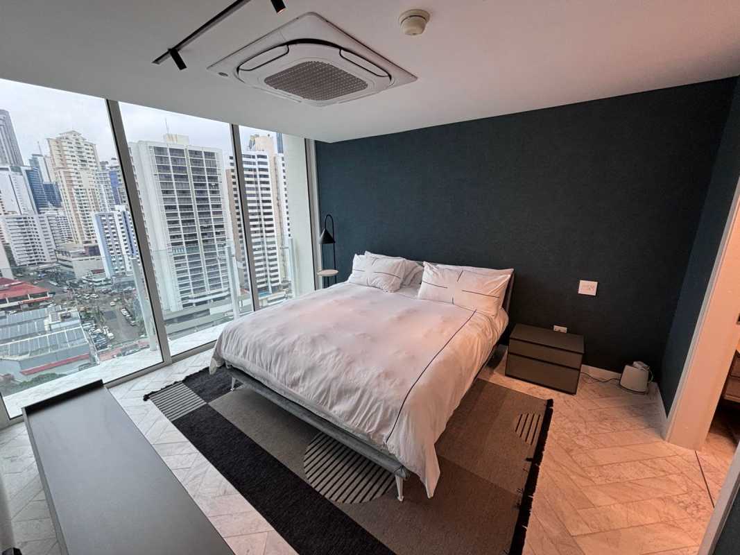 Marble bathroom with double vanity, glass shower in PH YOO Panama luxury apartment