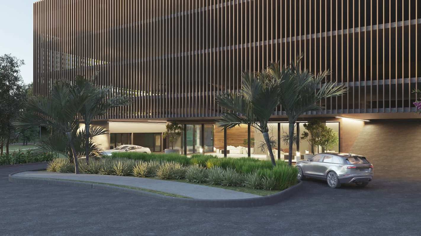 Modern condo entrance with landscaped driveway and wooden facade