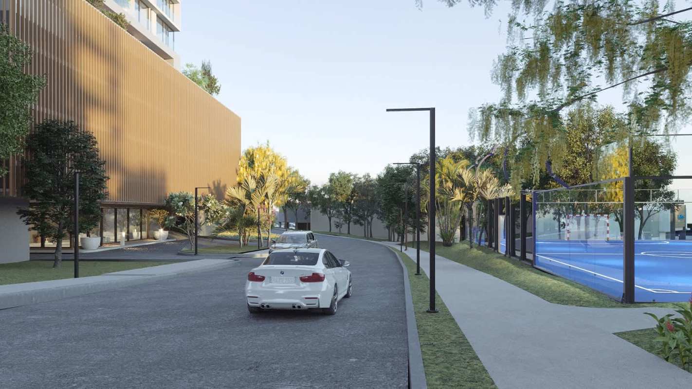 Outdoor sports court with glass fencing in green residential Panama complex