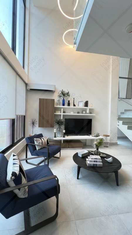 Bright modern kitchen with quartz countertops and premium cabinetry in Brisas del Golf