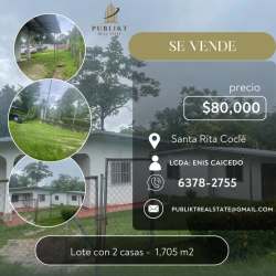 Large residential lot with two white houses, fence, lawn Santa Rita Coclé Panama