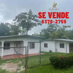 Covered parking area with grassy yard fenced property for sale in Santa Rita Coclé Panama