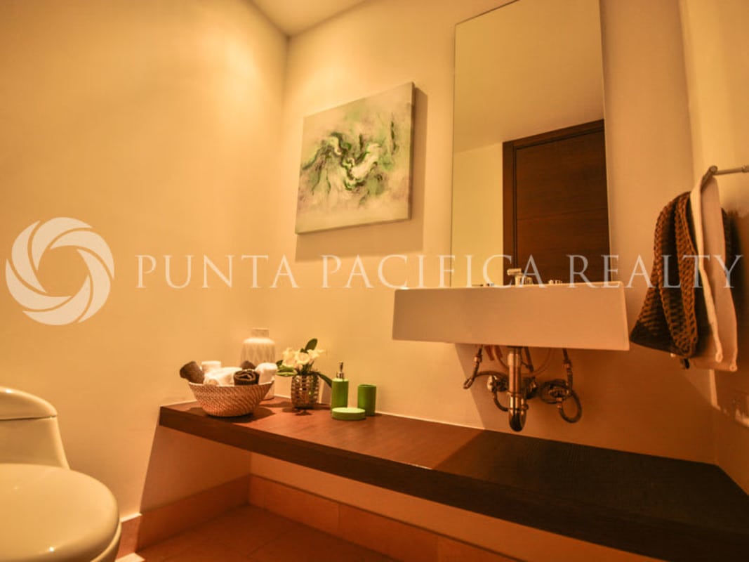 Modern guest bathroom with marble countertops and walk-in shower JW Marriott Punta Pacifica Panama