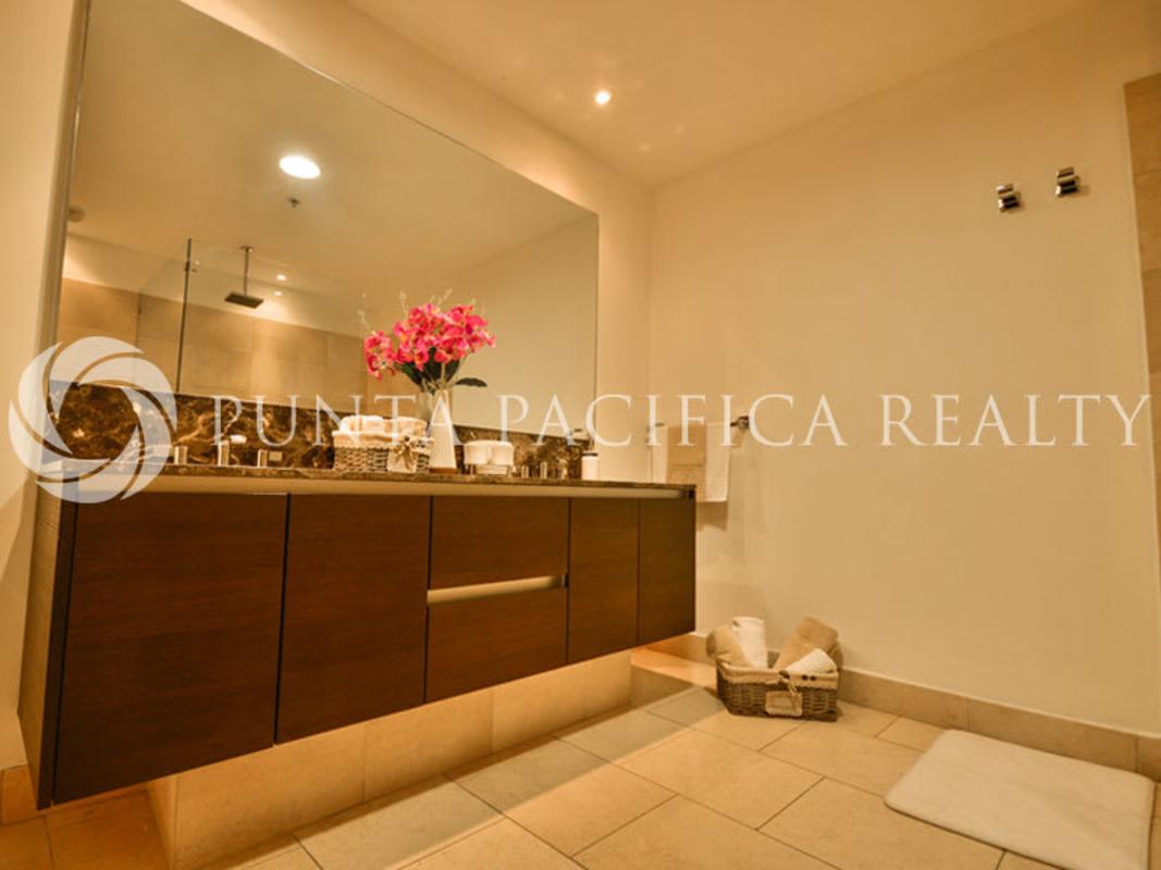 Elegant master bathroom with walk-in shower, soaking tub, marble finishes in JW Marriott Punta Pacifica Panama