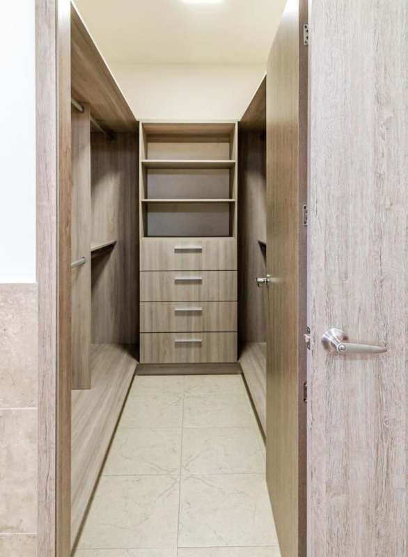 Bright entry hall with high ceilings modern staircase Costa del Este Panama