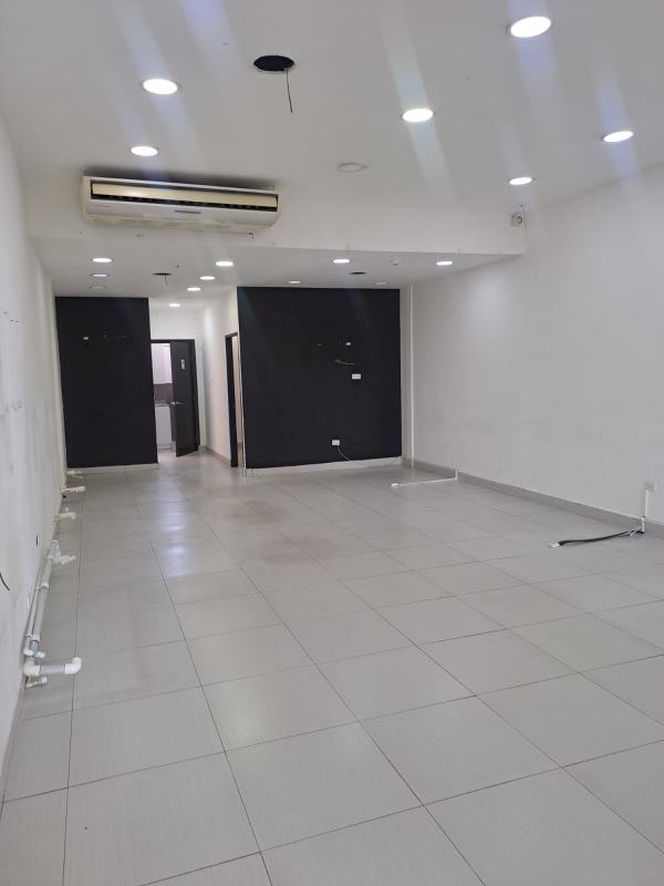 Commercial retail unit with gray tiles recessed lighting AC unit San Francisco Panama