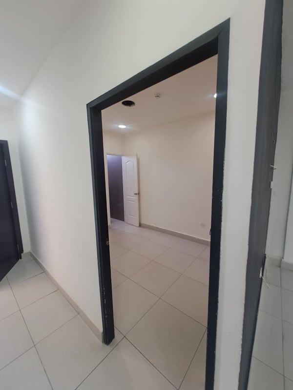 Clean hallway with ceramic floor tiles and recessed lights in commercial plaza San Francisco Panama