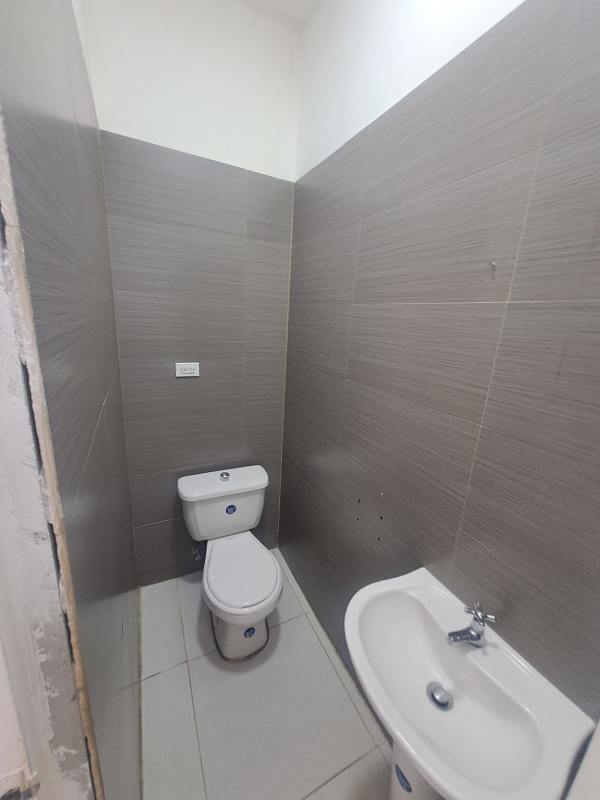 Tiled bathroom inside commercial unit with sink and toilet San Francisco Panama