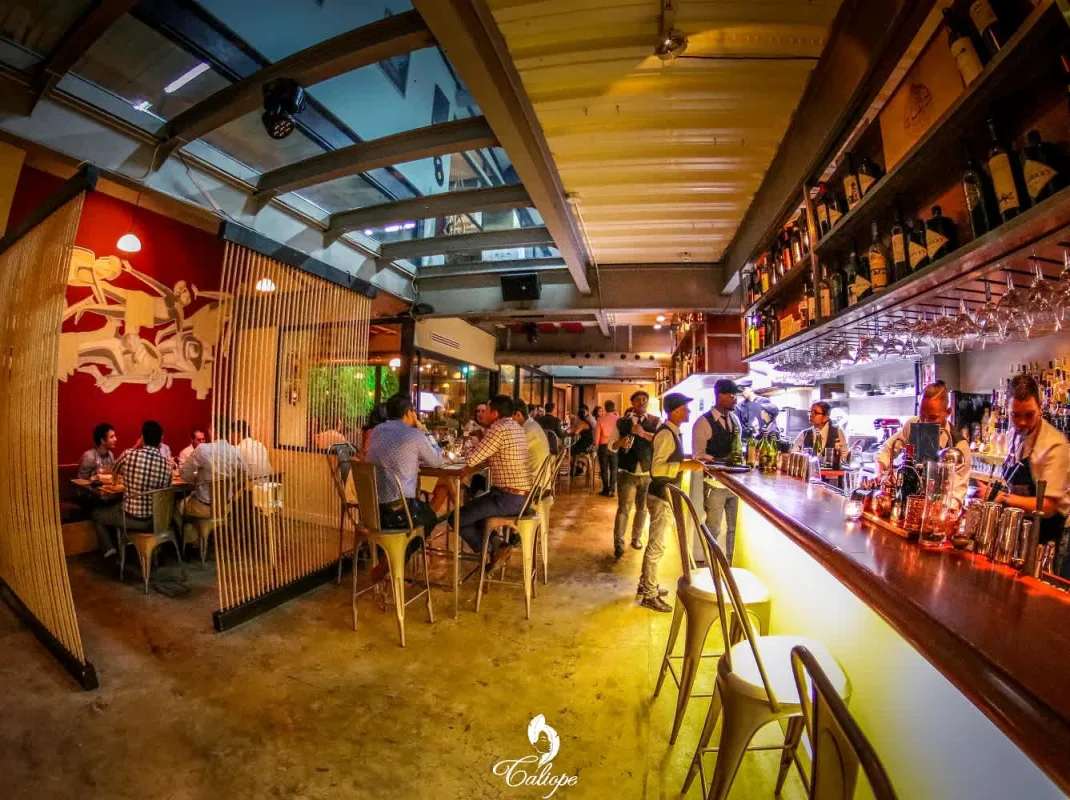 Outdoor terrace with lush vertical garden wall at Teatro Amador Casco Viejo Panama