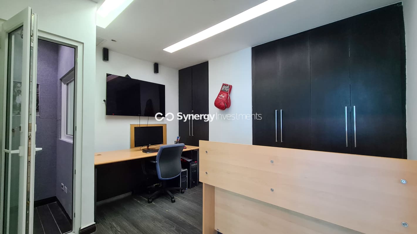 Compact kitchenette area with granite counters in PH BICSA Tower office