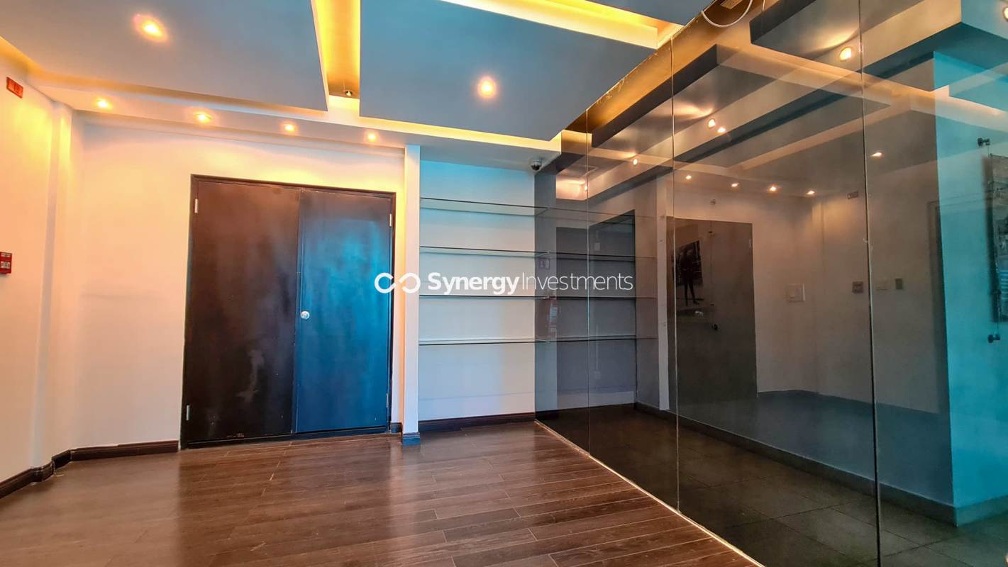 Private office with glass partitions and natural light in PH BICSA Tower