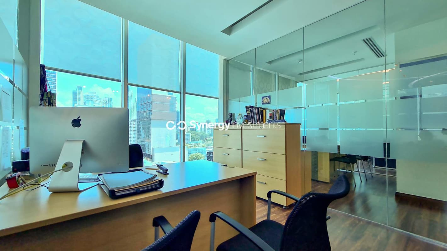 Private workspace with glass walls and ocean horizon at PH BICSA Tower Avenida Balboa