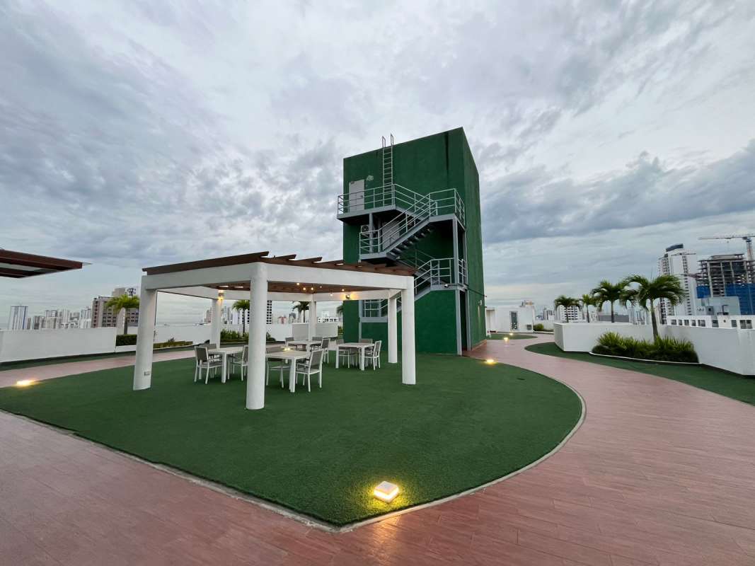 Fully equipped gym at PH Midpark Carrasquilla with cardio equipment and city views