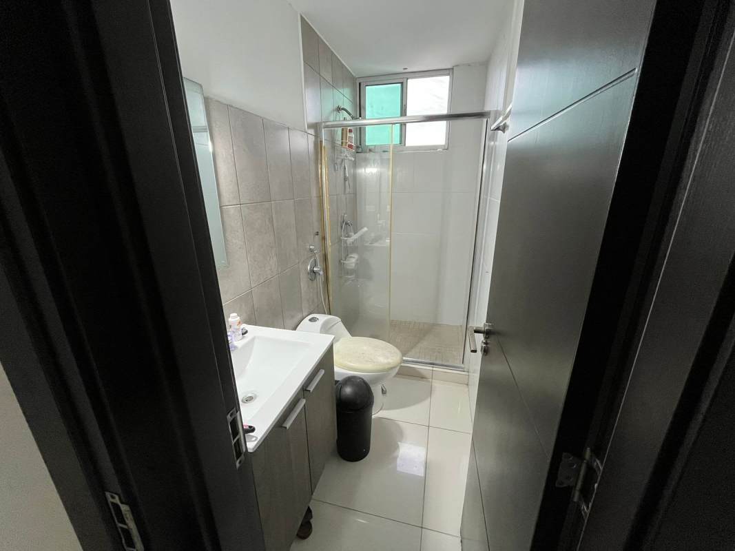 Covered outdoor pool with lounge chairs at PH Midpark Carrasquilla