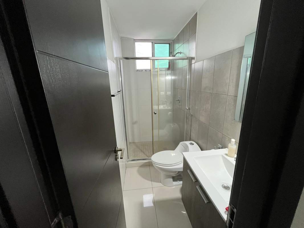 Modern apartment kitchen with granite counters, gas stove, refrigerator space PH Midpark Carrasquilla