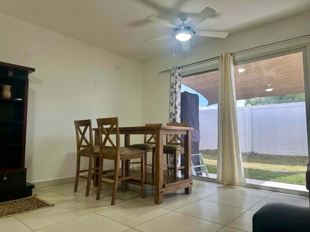 Contemporary kitchen with granite countertops and tile backsplash Costa Sur rental house