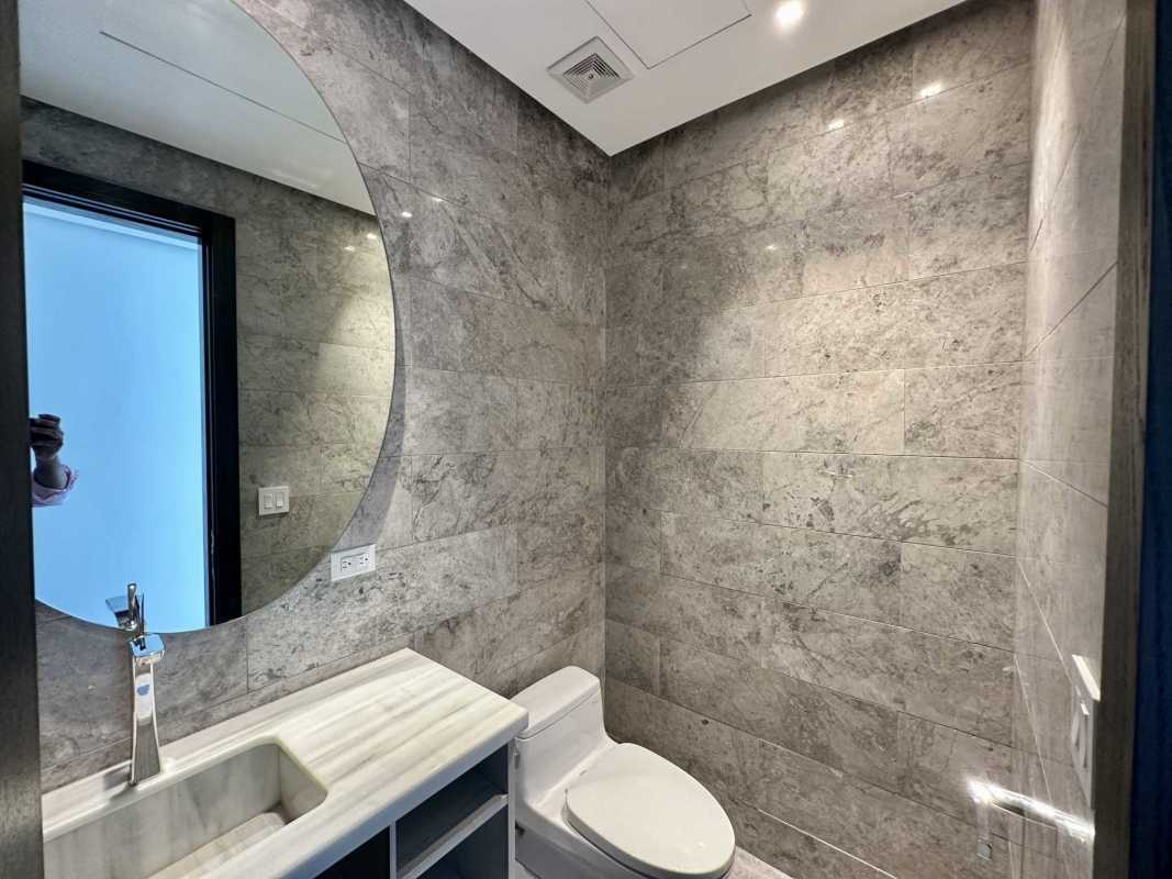 Modern kitchen with marble countertops, high-end appliances in PH Sea Point luxury condo at Punta Paitilla Panama