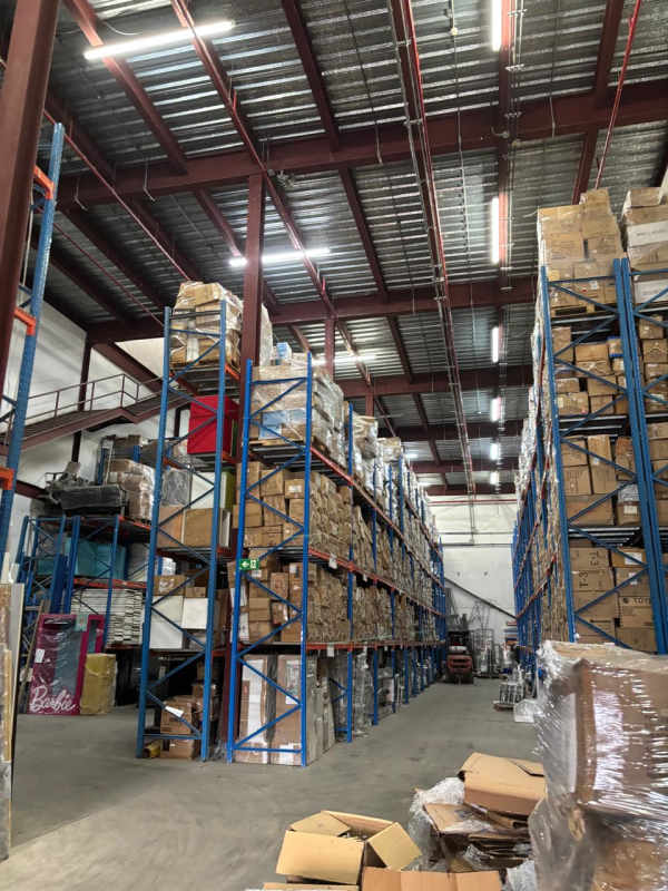 Warehouse interior with mezzanine office and storage racks Milla 9 Las Cumbres Panama City