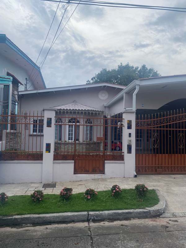 Single-family home for sale in Altos del Chase El Dorado with iron fencing, gated carport, garden area