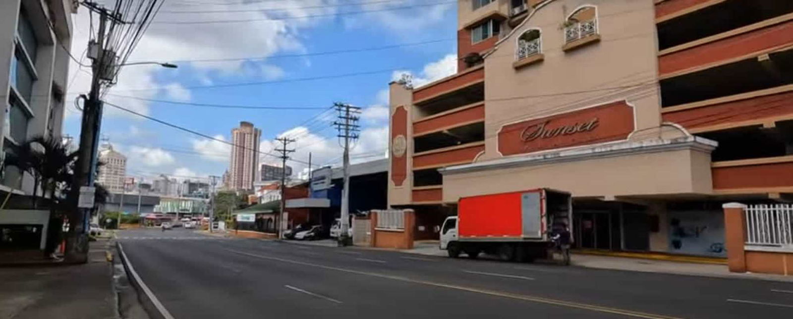 Supermarket plaza and parking area on urban street San Francisco Panama City