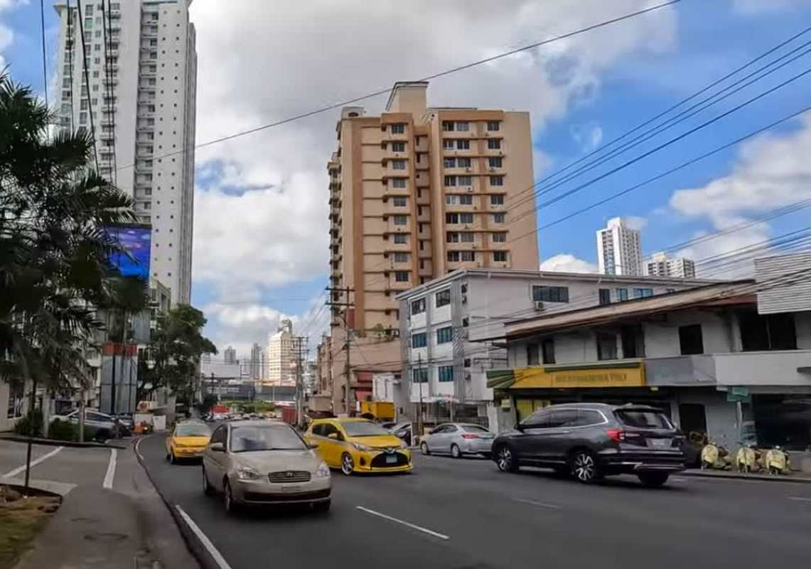 City view with apartment towers above ground level stores in San Francisco Panama