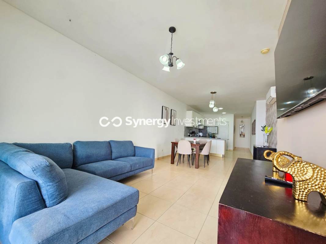 Fully furnished kitchen with granite counters, stainless appliances, and open dining at PH BICSA Avenida Balboa Panama City