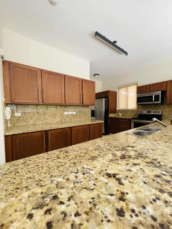 Open living dining room with garden balcony Embassy Club Clayton apartment for rent