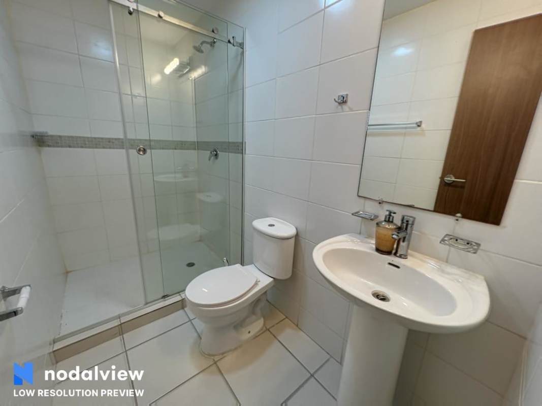 Modern bathroom with walk-in shower and pedestal sink PH Villa Lucre Residences Panama