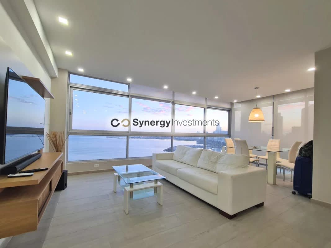 Large bedroom with ocean view, walk-in closet, modern decor in PH Yacht Club Tower Panama City