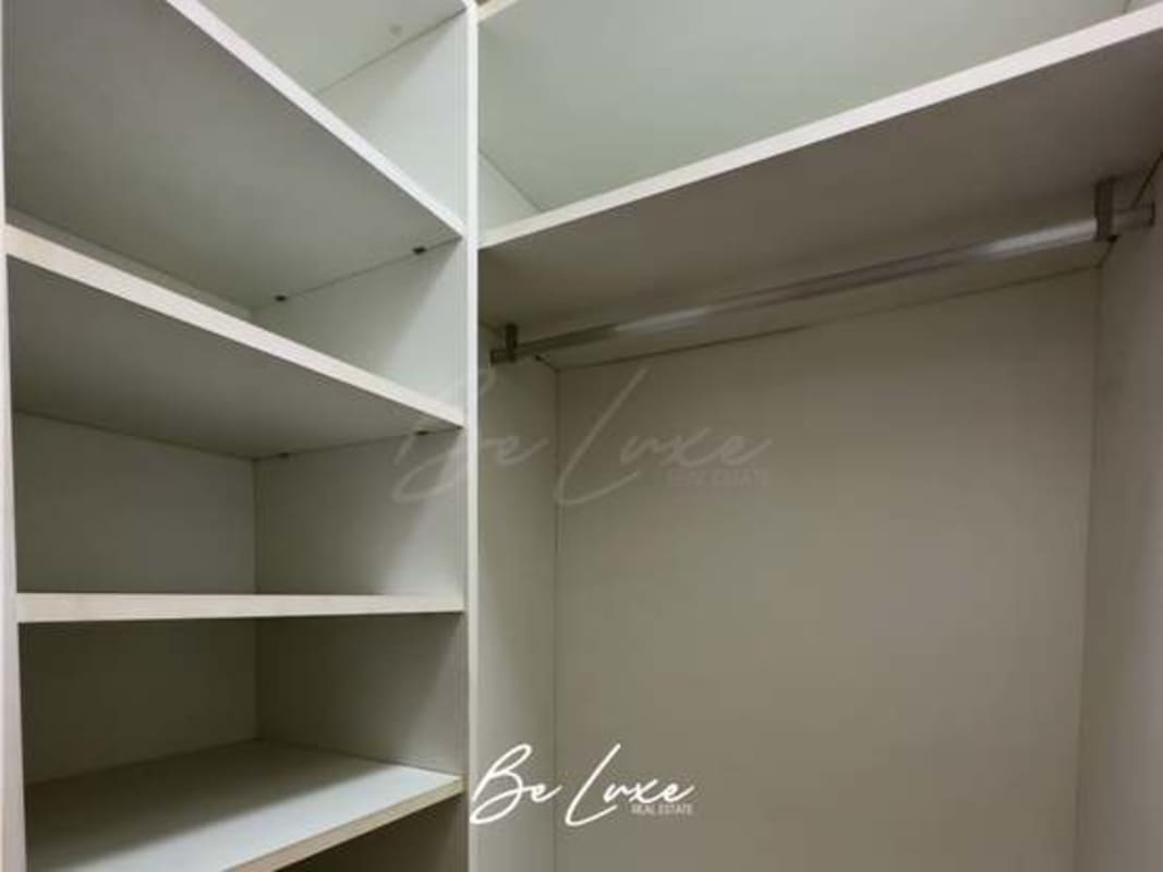 Second bedroom with modern furnishings, city skyline view in PH Yoo Panama luxury apartment