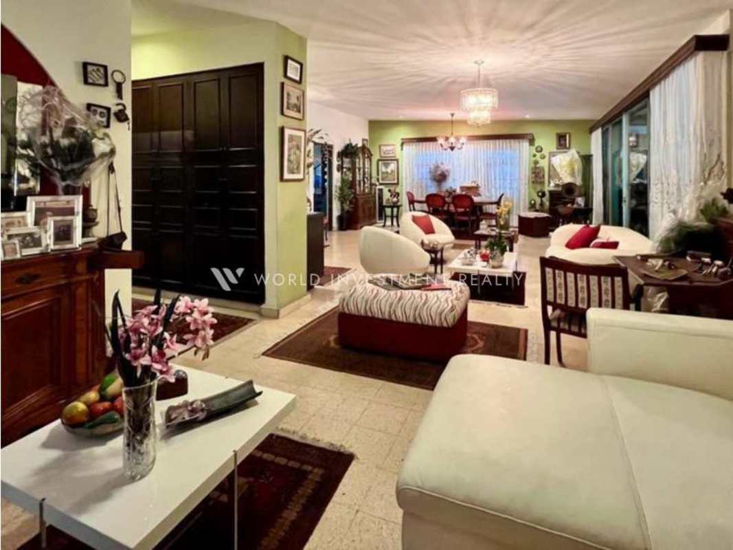 Spacious living room with natural light in Hato Pintado house for sale